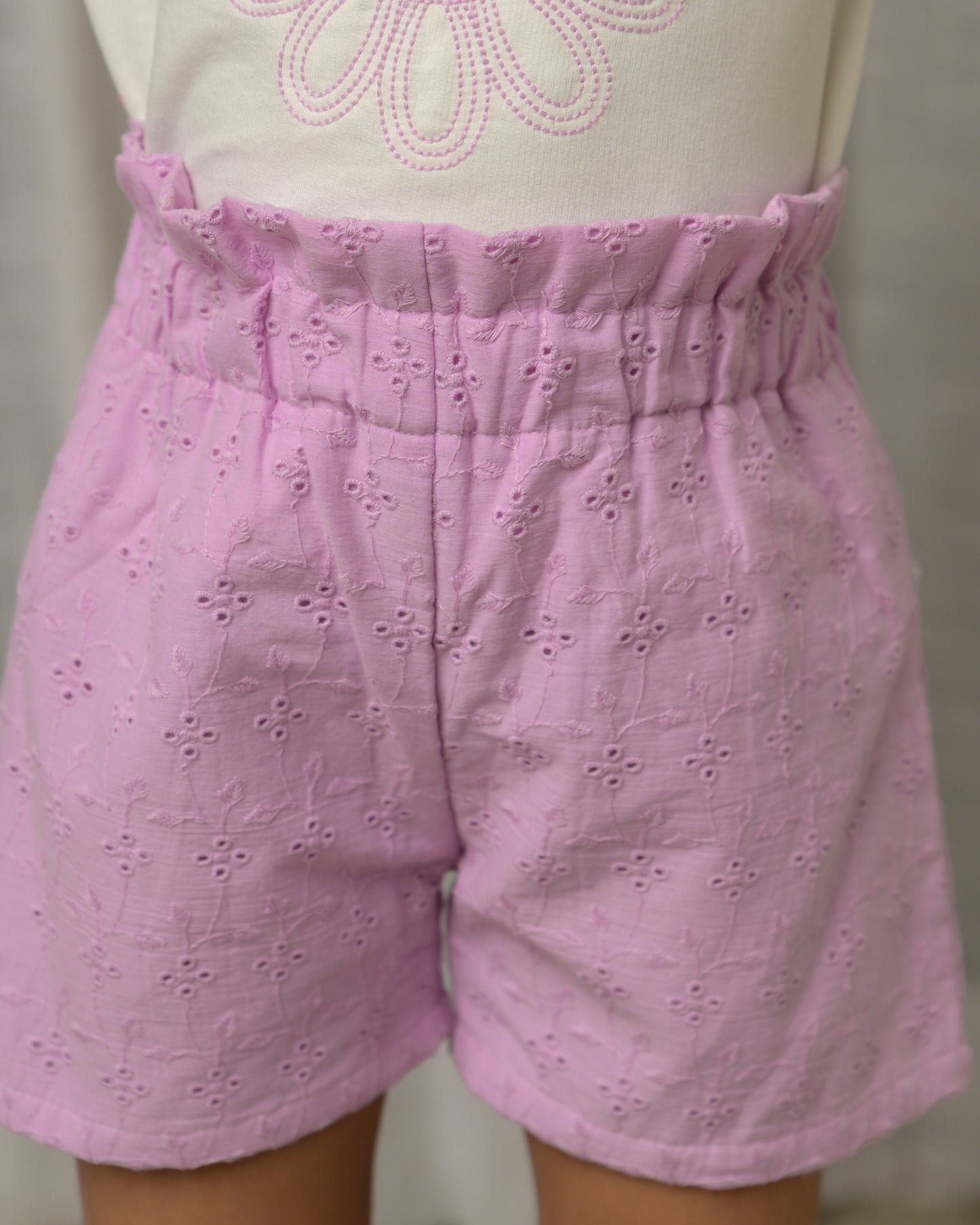 White Top And Purple Shorts