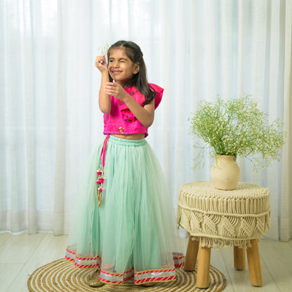 Hot Pink Ruffled Top With Green Net Lehenga