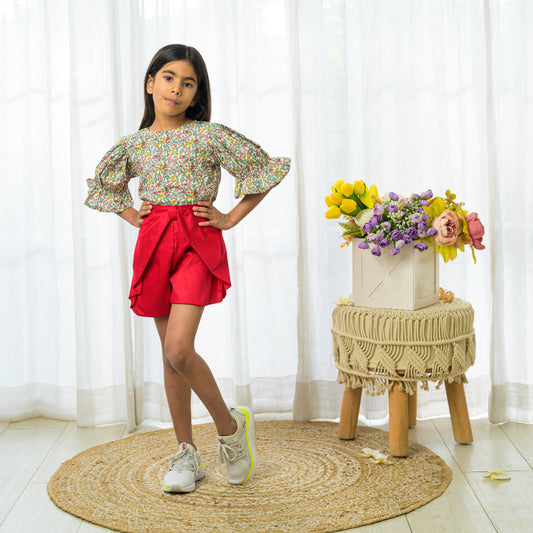 Floral print top with red shorts